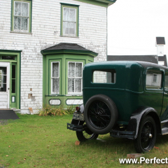 Front yard, old car, Memory Lane Heritage Village, Museum in Lake Charlotte, Nova Scotia, Canada