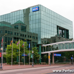 Moncton City Hall, Cube glass building, Main Street, Moncton, New Brunswick, Canada, North America; Pedway, flags