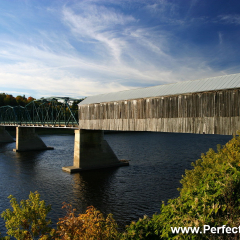 Old wooden covered bridge over Saint John river.  Hybrid bridge with traditional trestle bridge.