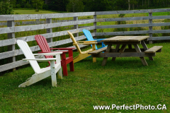 adirondack chairs. Burntcoat lighthouse, Noel, Nova Scotia, Colour, color, red, yellow, blue; Picnic table