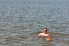 Man swimming, in salt water ocean bay,  Noel, East Hants, Nova Scotia, Canada