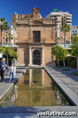 Reflecting pool, Seaman chapel 1531, Waterfront promenade, Malaga, Spain 2024