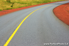 Curve in the road, highway, pavement, red gravel curb, Truro, Nova Scotia, Canada, North America